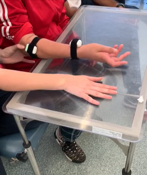A hands-on table exercise with a LusioMATE sensor worn on the wrist